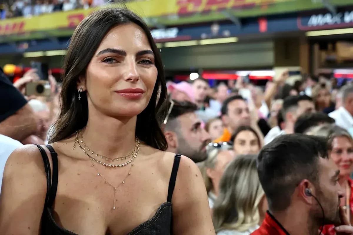 Woman smiling in a crowded stadium audience Woman smiling in a crowded stadium audience
