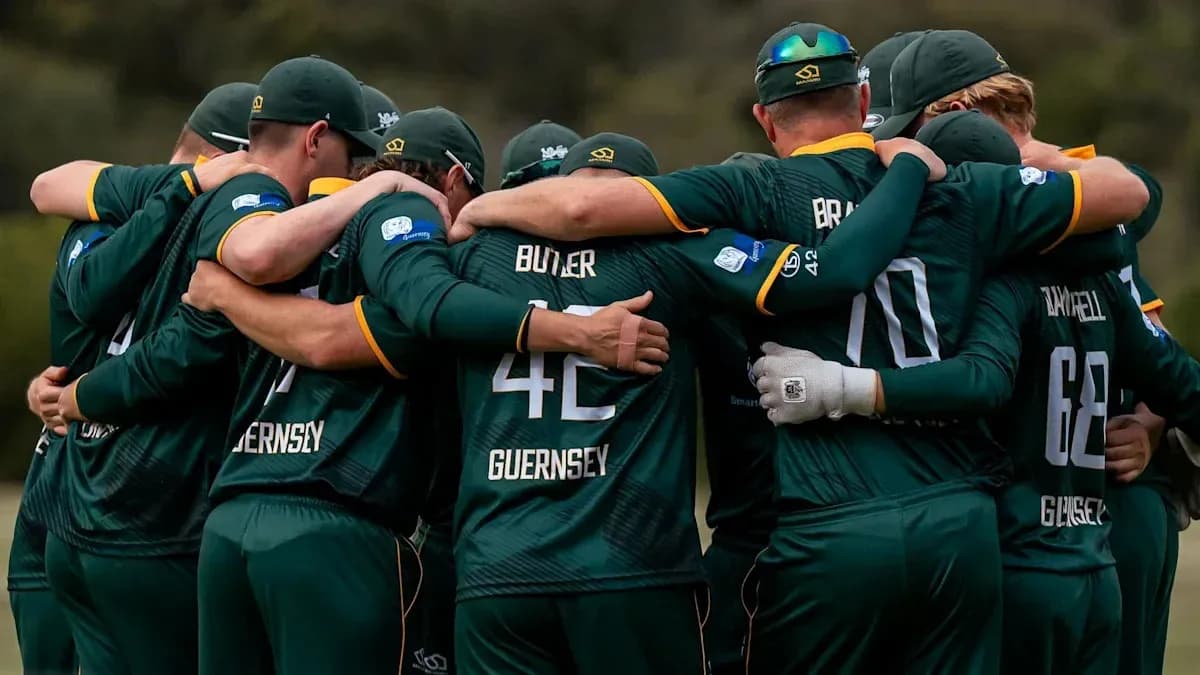 Cricket team huddled together in unity Cricket team huddled together in unity