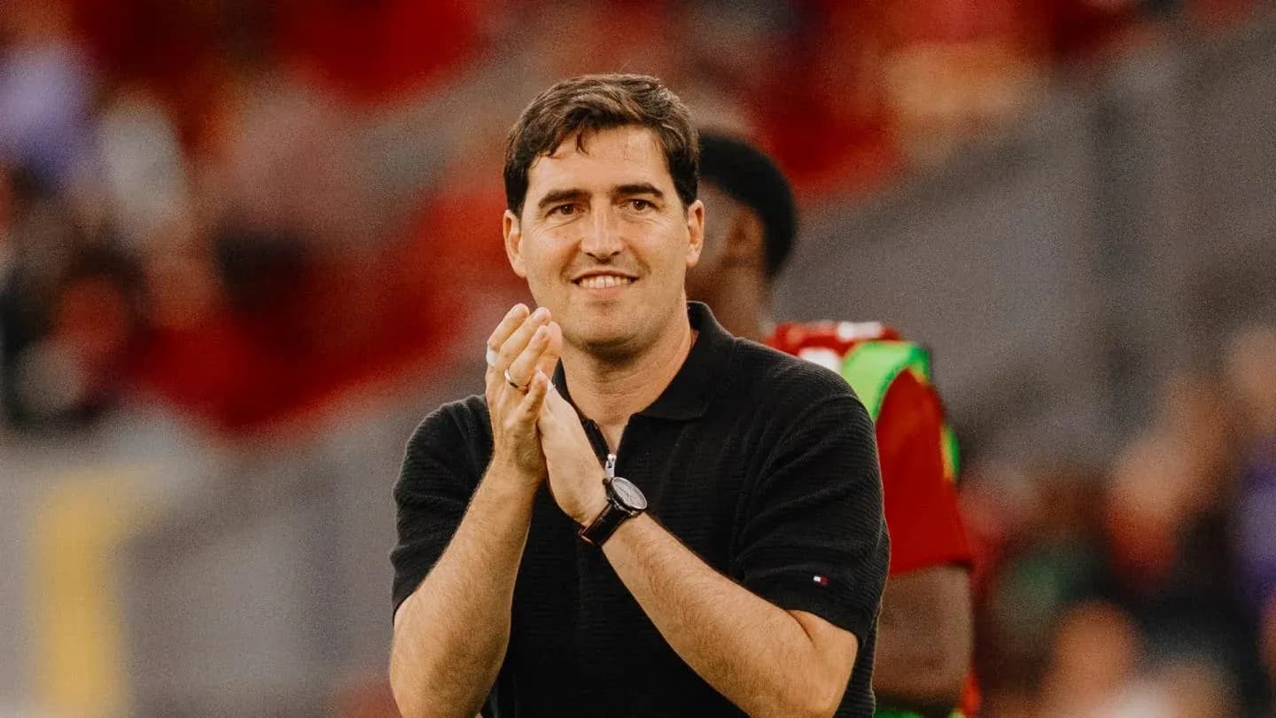 Coach clapping during a match on the sidelines Coach clapping during a match on the sidelines