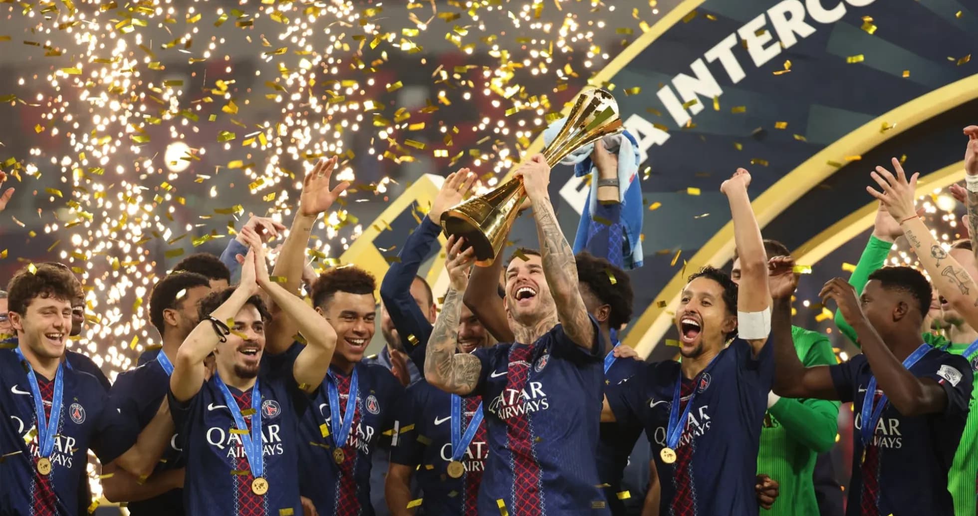 PSG players celebrating with trophy and confetti PSG players celebrating with trophy and confetti