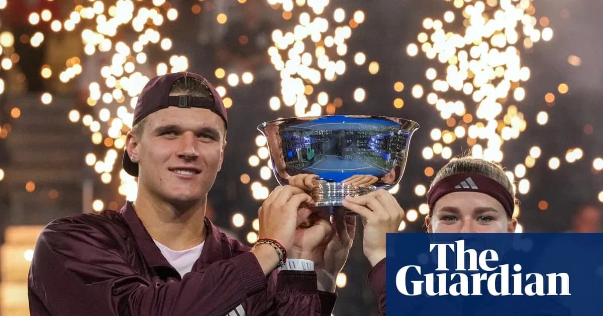 Two players celebrating victory with trophy and fireworks Two players celebrating victory with trophy and fireworks