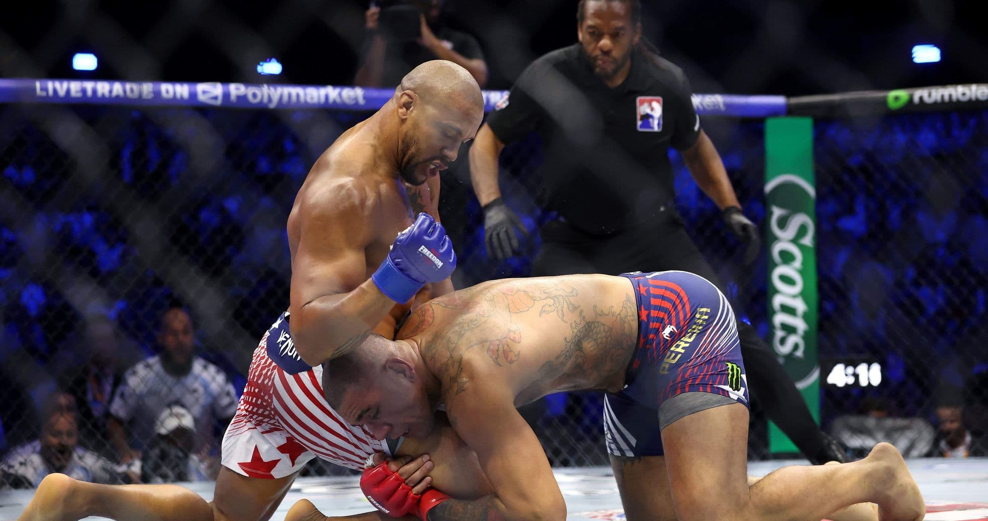 Fighters grappling during MMA match in octagon Fighters grappling during MMA match in octagon