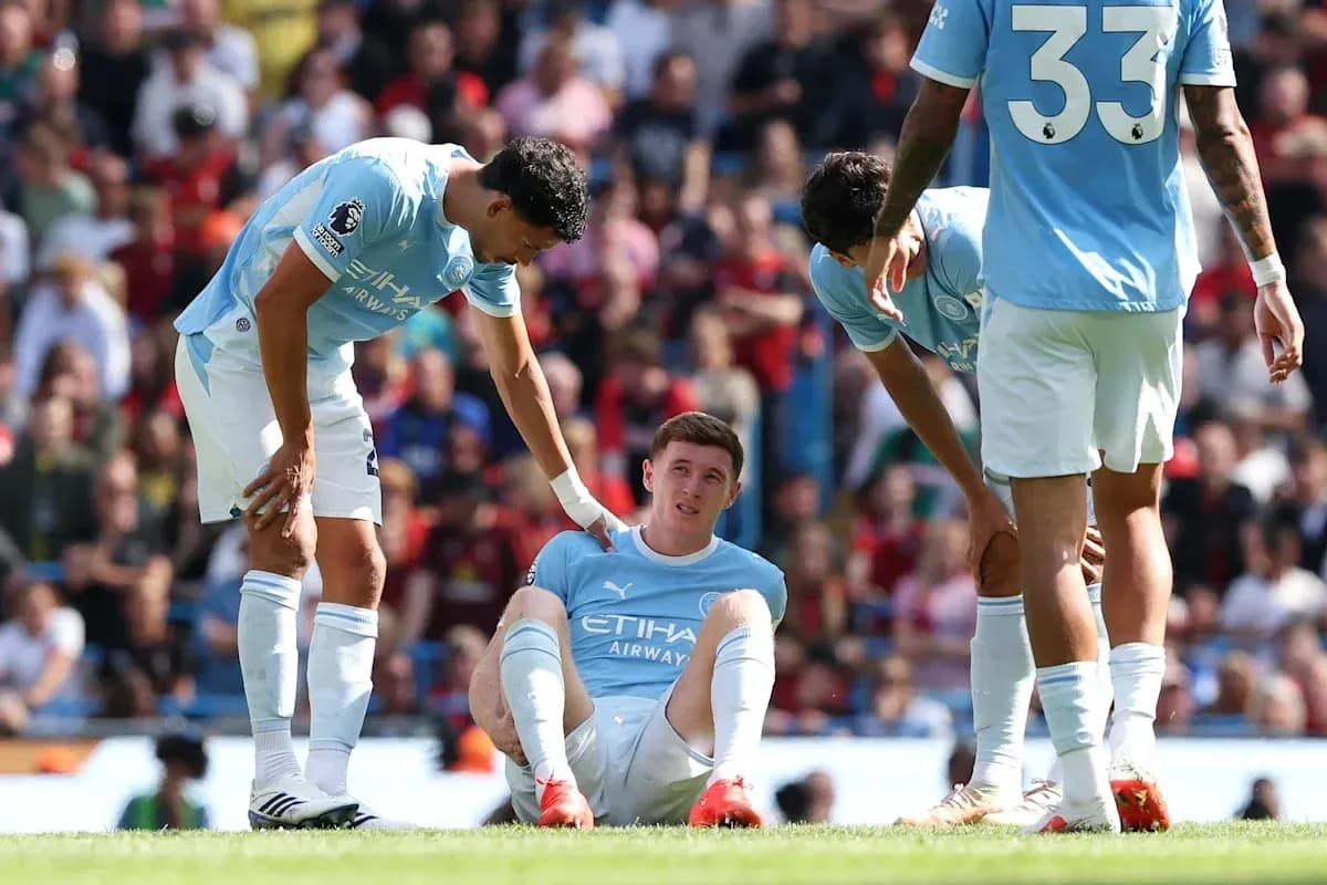 Manchester City players attend to injured teammate Manchester City players attend to injured teammate