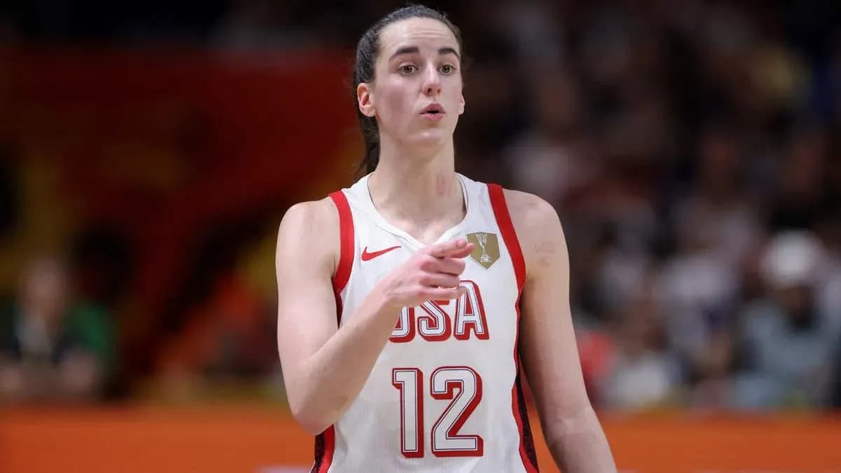 Player in USA jersey directing teammates during game Player in USA jersey directing teammates during game