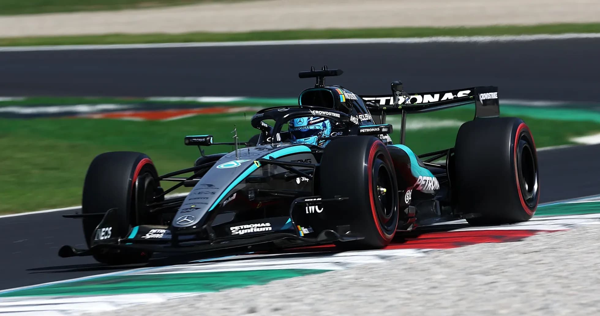 Mercedes Formula 1 car racing on track Mercedes Formula 1 car racing on track