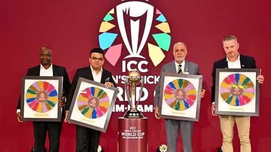 Four officials holding ICC Cricket World Cup memorabilia Four officials holding ICC Cricket World Cup memorabilia