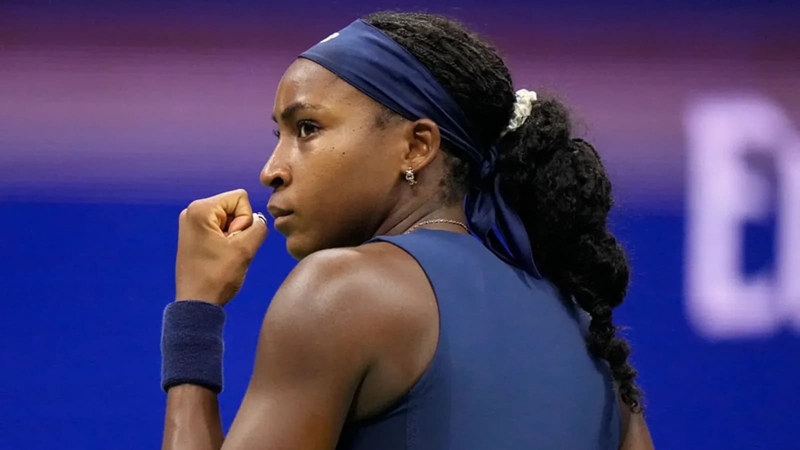 Tennis player celebrating during a match Tennis player celebrating during a match