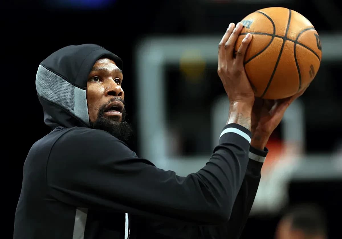 Player shooting basketball during practice session Player shooting basketball during practice session