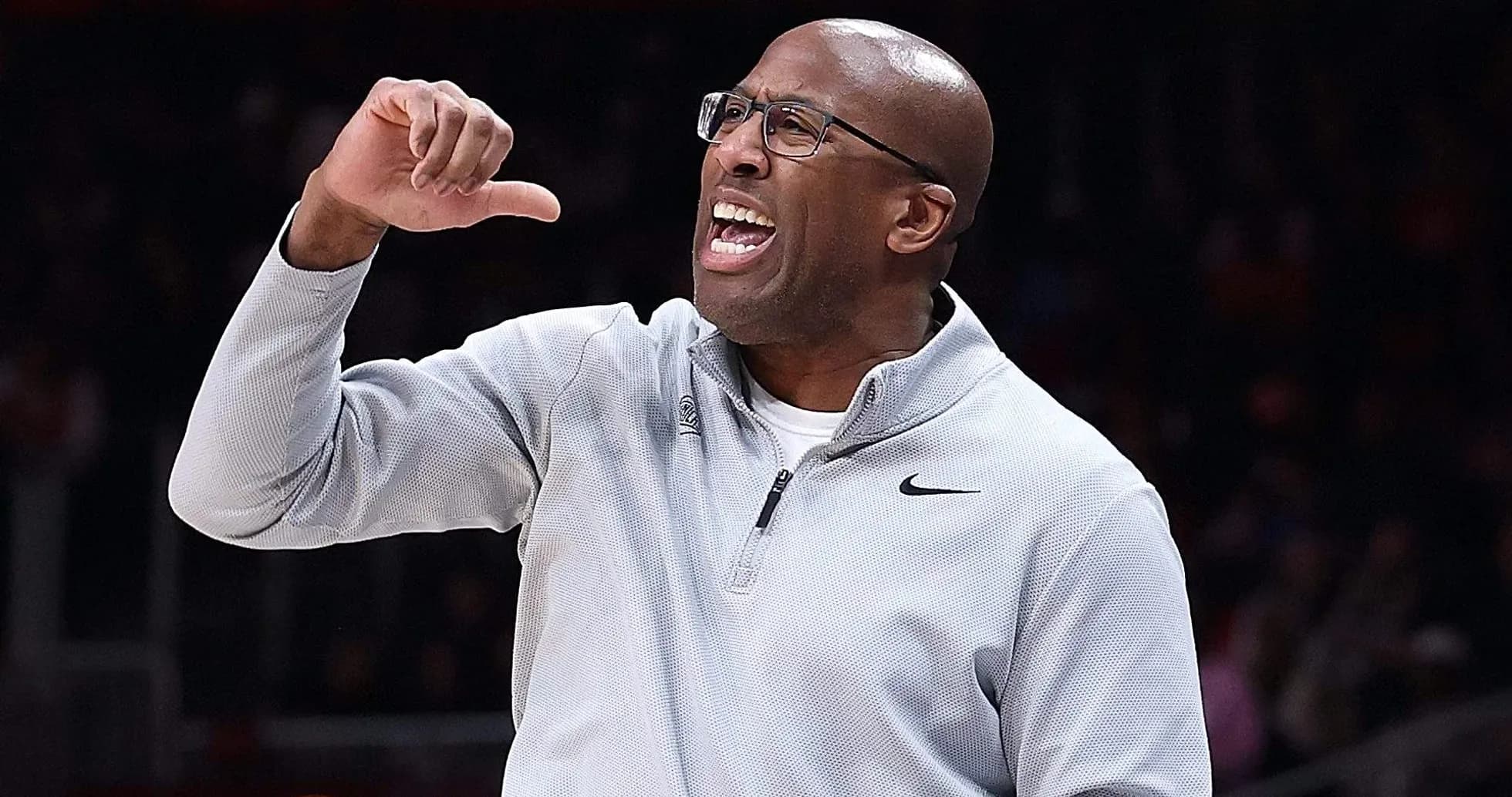 Coach gesturing and directing players during game Coach gesturing and directing players during game