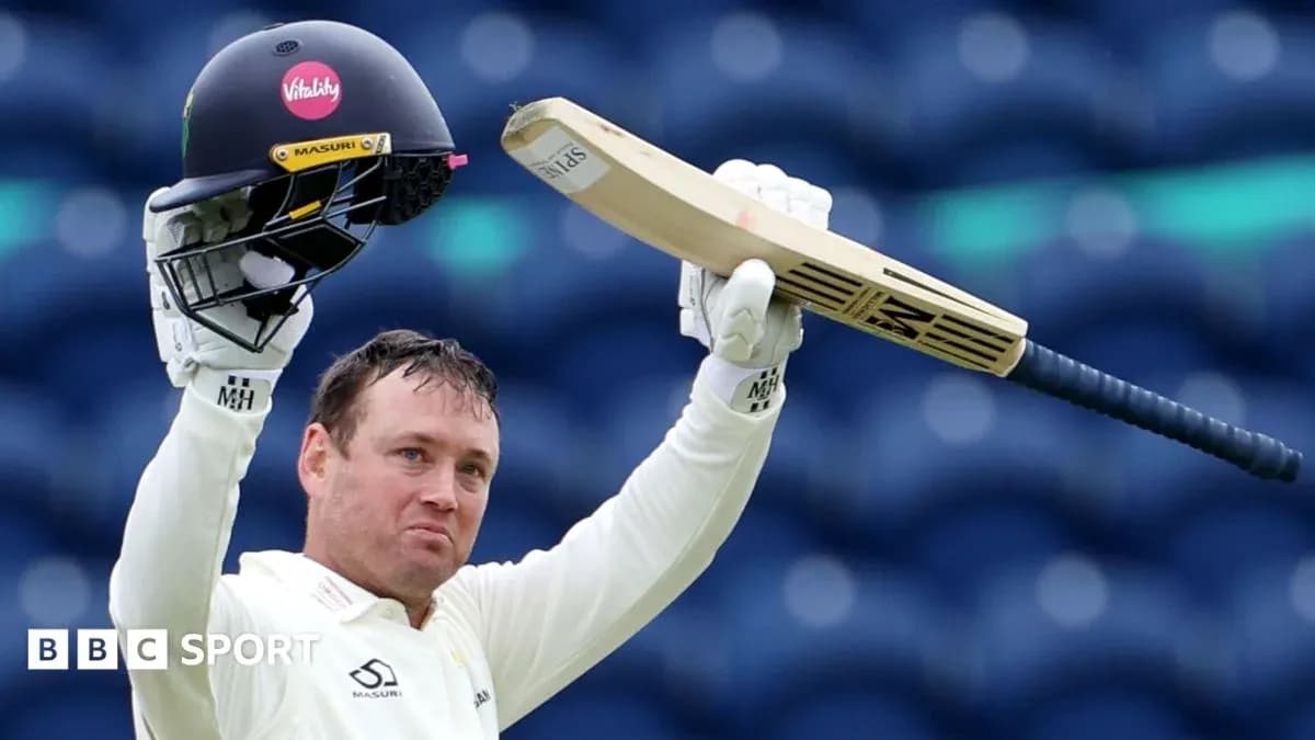 Batsman raising bat and helmet in celebration Batsman raising bat and helmet in celebration