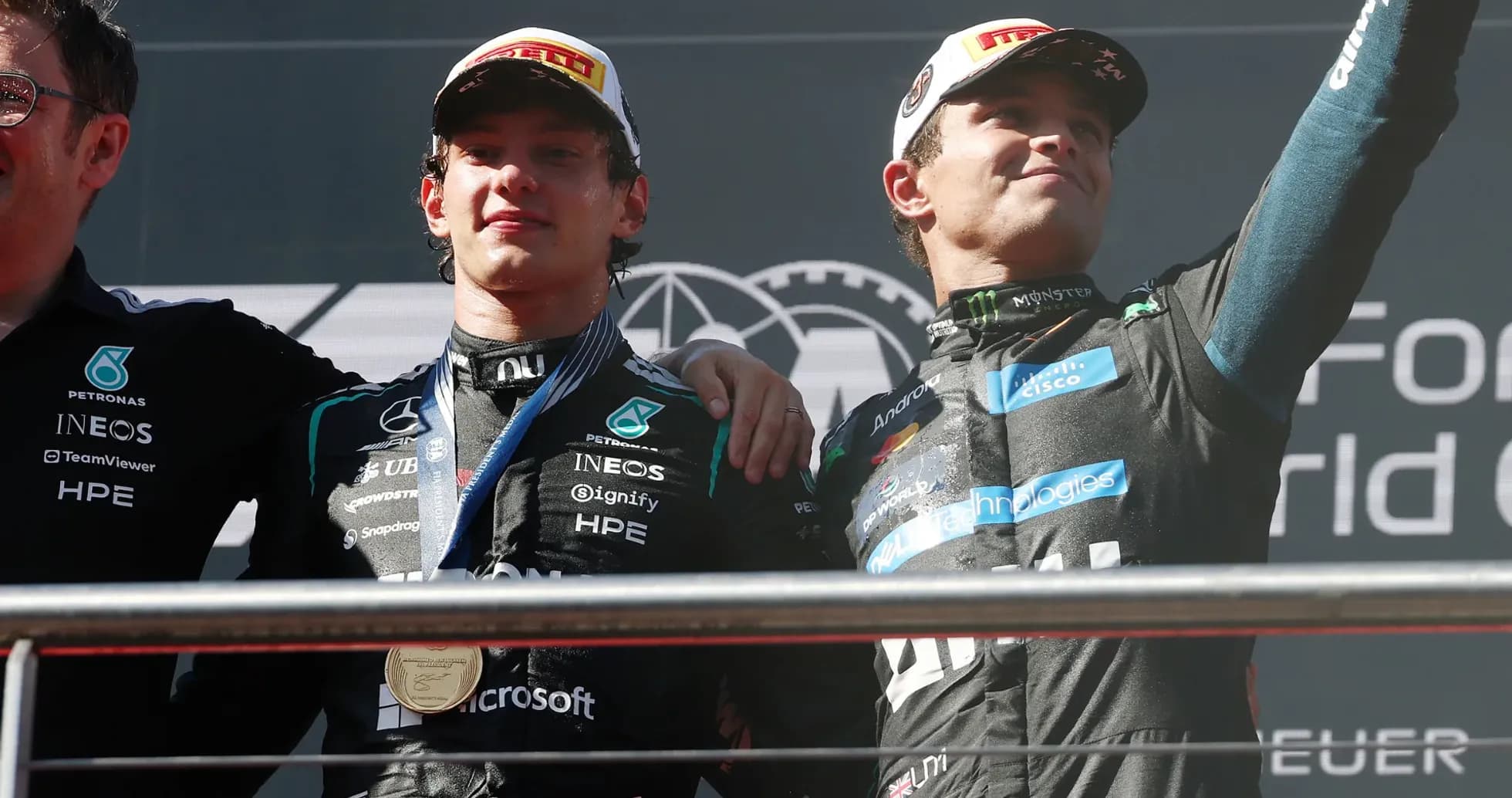 Drivers celebrating on podium after race victory Drivers celebrating on podium after race victory
