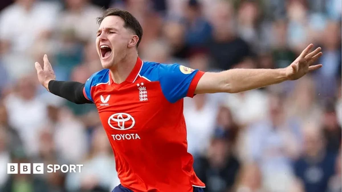 Cricketer celebrating a wicket in red England kit Cricketer celebrating a wicket in red England kit