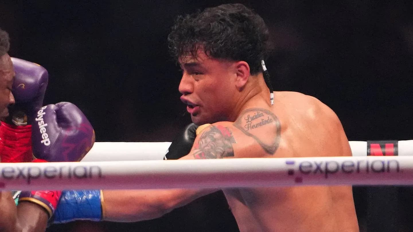 Boxer throwing a punch during a match Boxer throwing a punch during a match