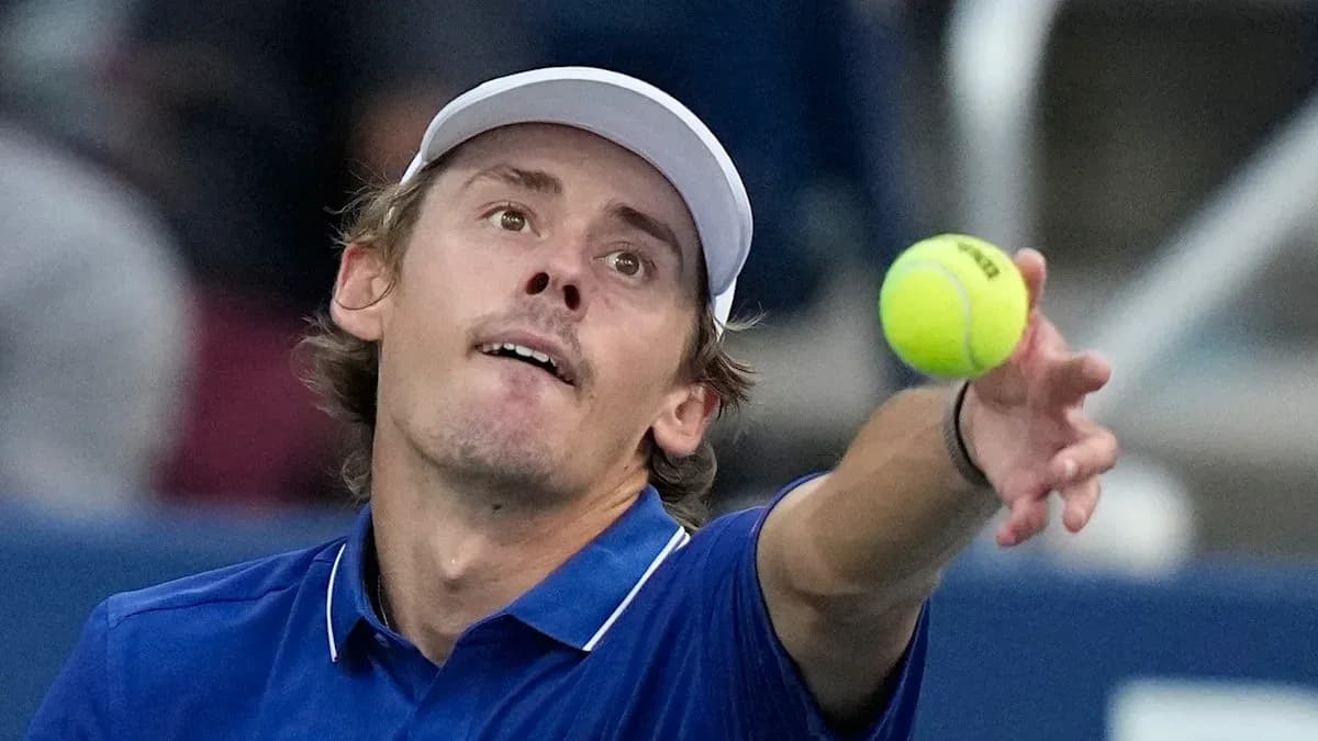 Player serving tennis ball during match Player serving tennis ball during match