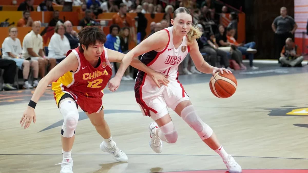 USA player dribbling past China defender in game USA player dribbling past China defender in game