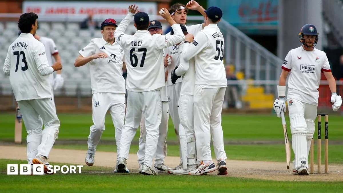 Cricket team celebrating a wicket during match Cricket team celebrating a wicket during match