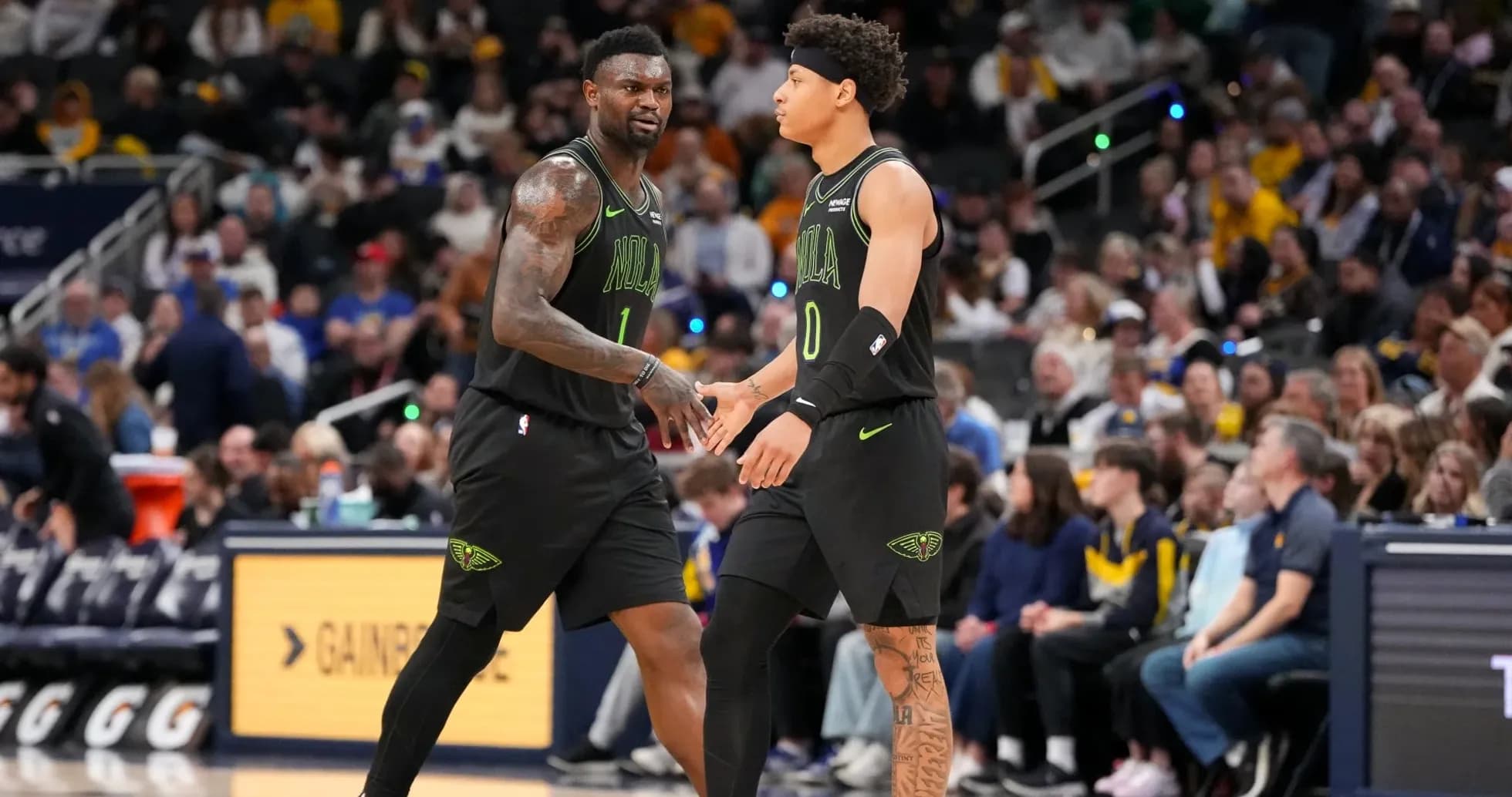 Two players celebrating during a basketball game Two players celebrating during a basketball game