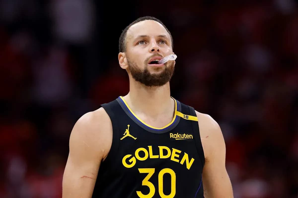 Player in Golden State jersey looking up during game Player in Golden State jersey looking up during game