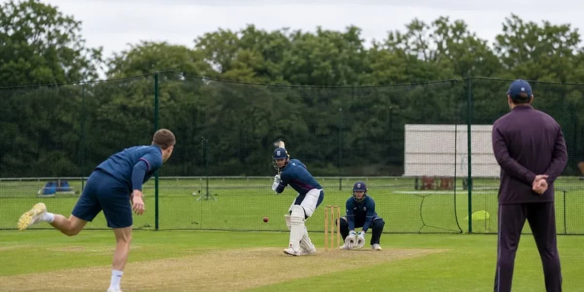 Batsman facing bowler during cricket training session Batsman facing bowler during cricket training session