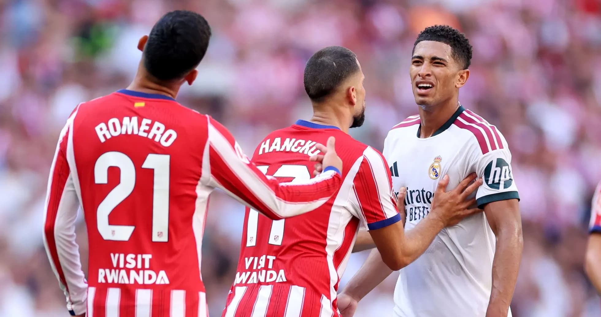 Three players in dispute during a football match Three players in dispute during a football match