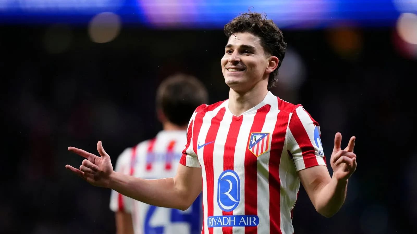 Atletico Madrid player celebrating after scoring Atletico Madrid player celebrating after scoring