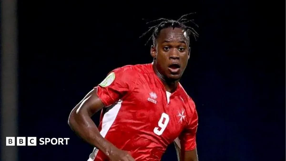 Player in red jersey running on the field Player in red jersey running on the field
