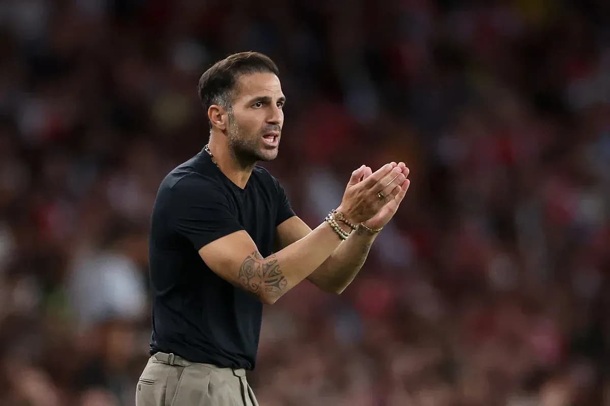 Coach gesturing and directing players from sidelines Coach gesturing and directing players from sidelines