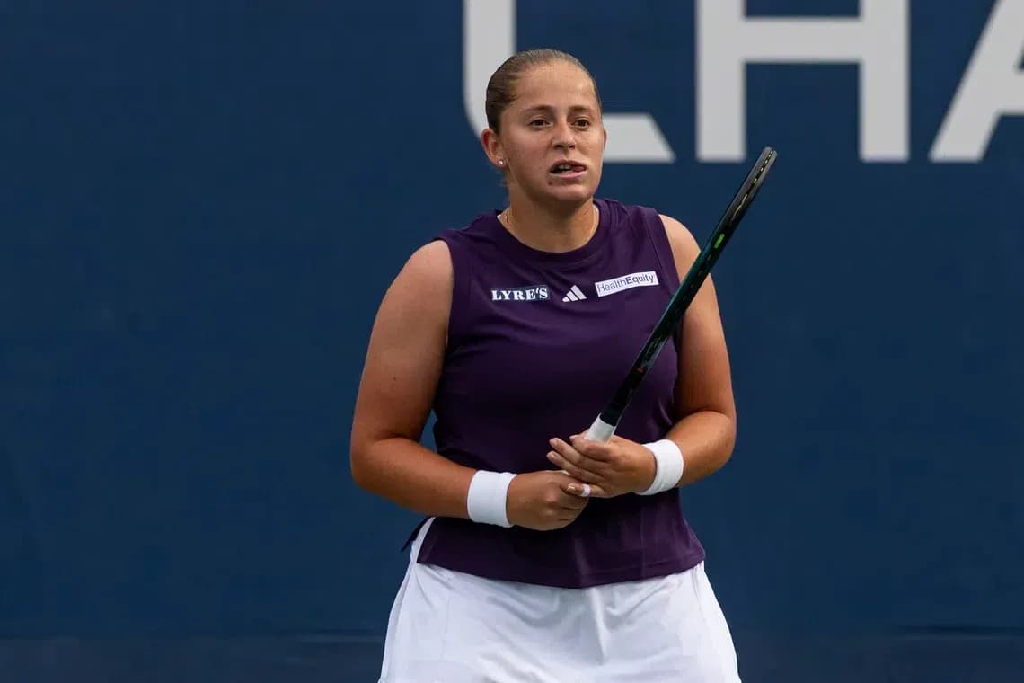 Tennis player holding racket during match preparation Tennis player holding racket during match preparation