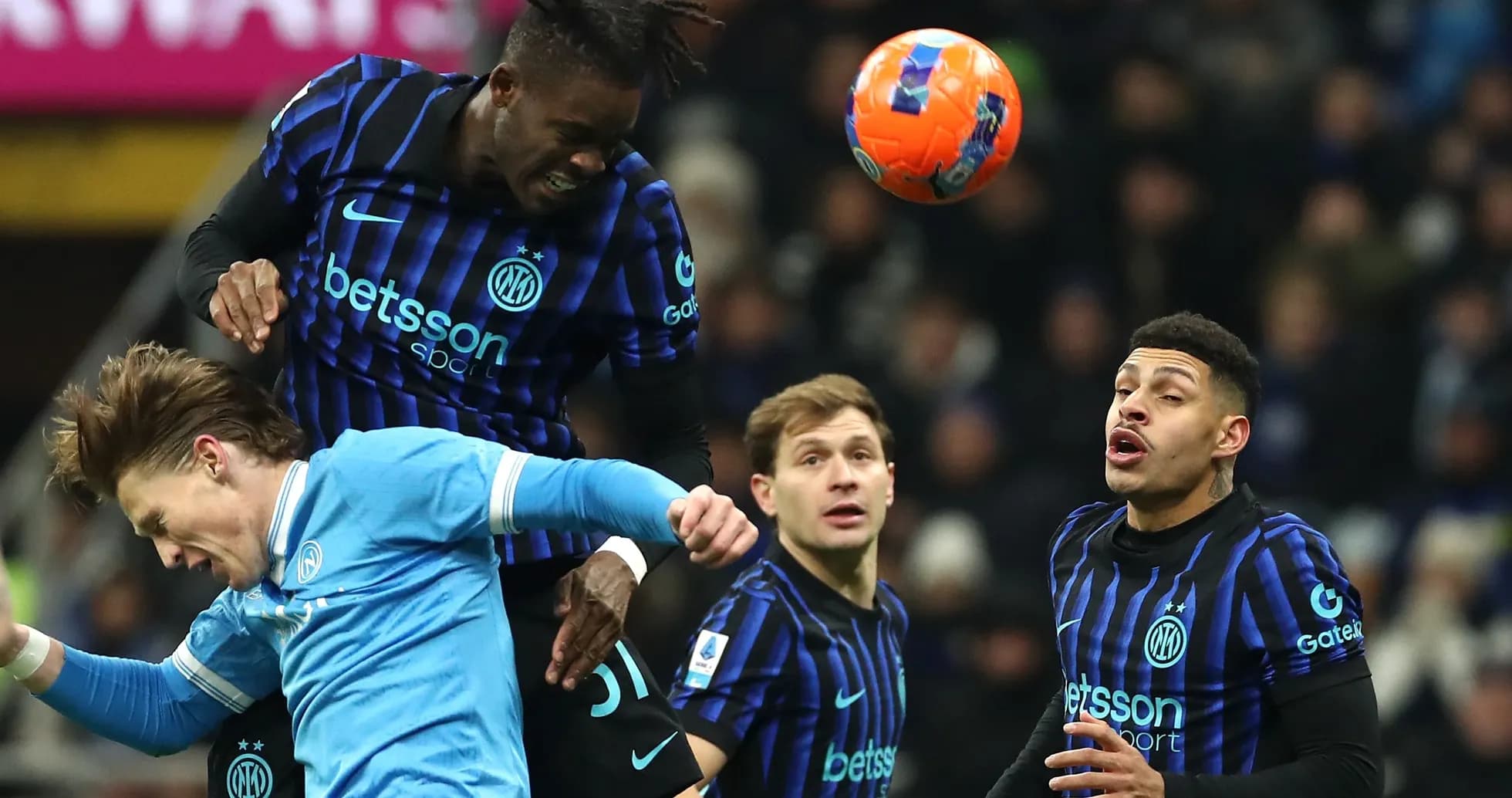 Players competing for a header during a match Players competing for a header during a match