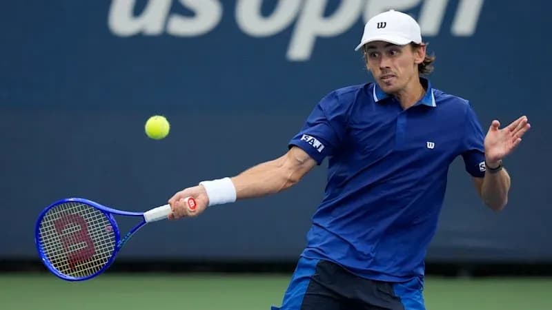 Player hitting a forehand during US Open match Player hitting a forehand during US Open match