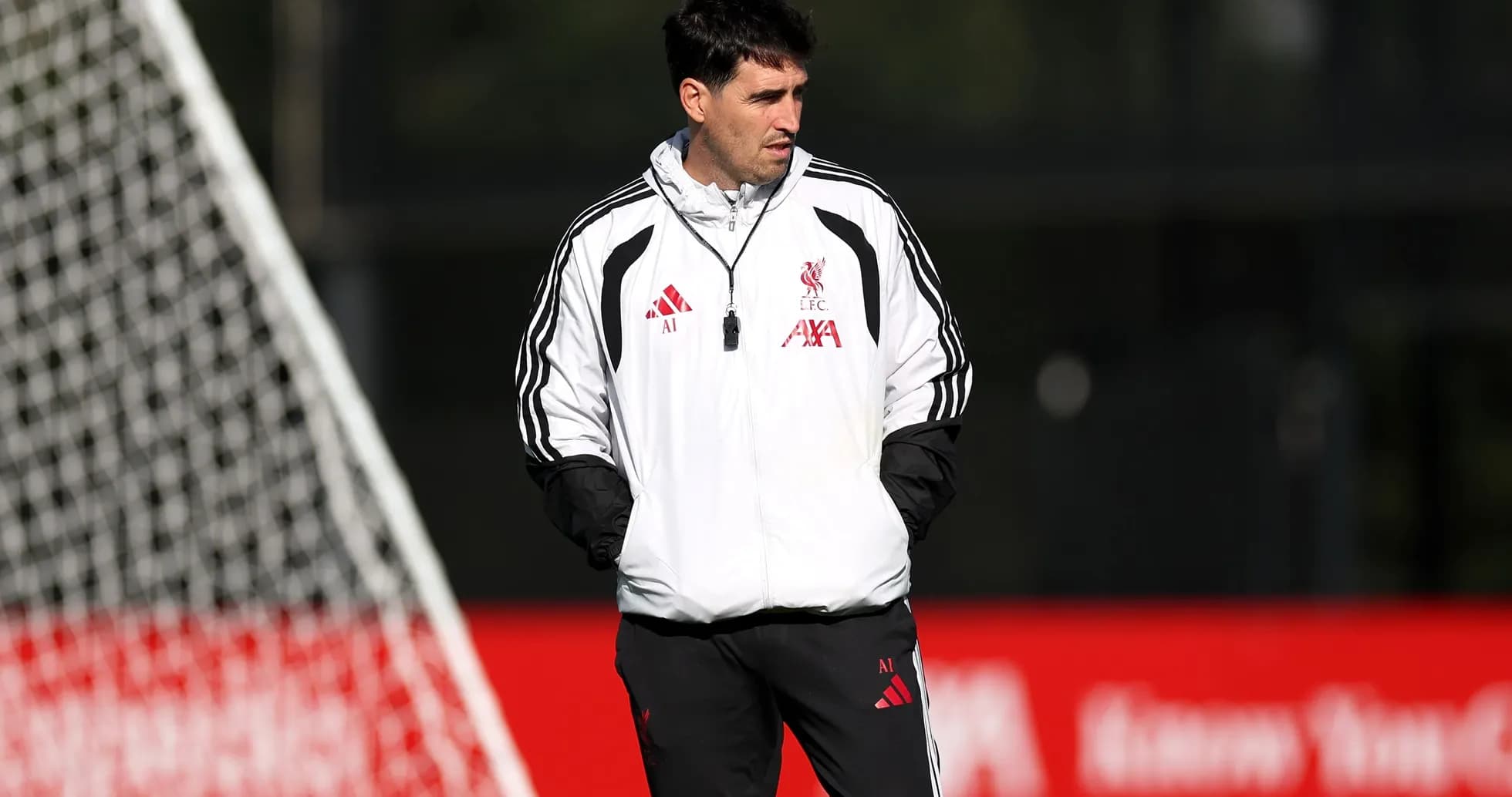 Coach observing players during Liverpool training session Coach observing players during Liverpool training session
