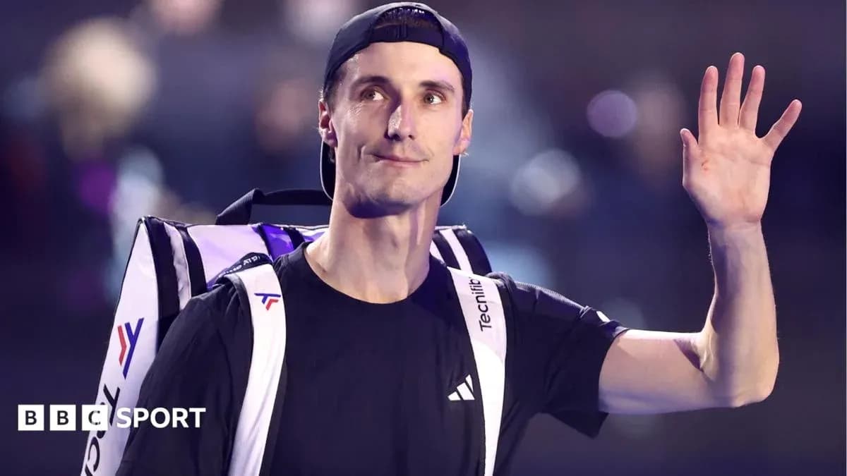 Tennis player waving while carrying backpack Tennis player waving while carrying backpack