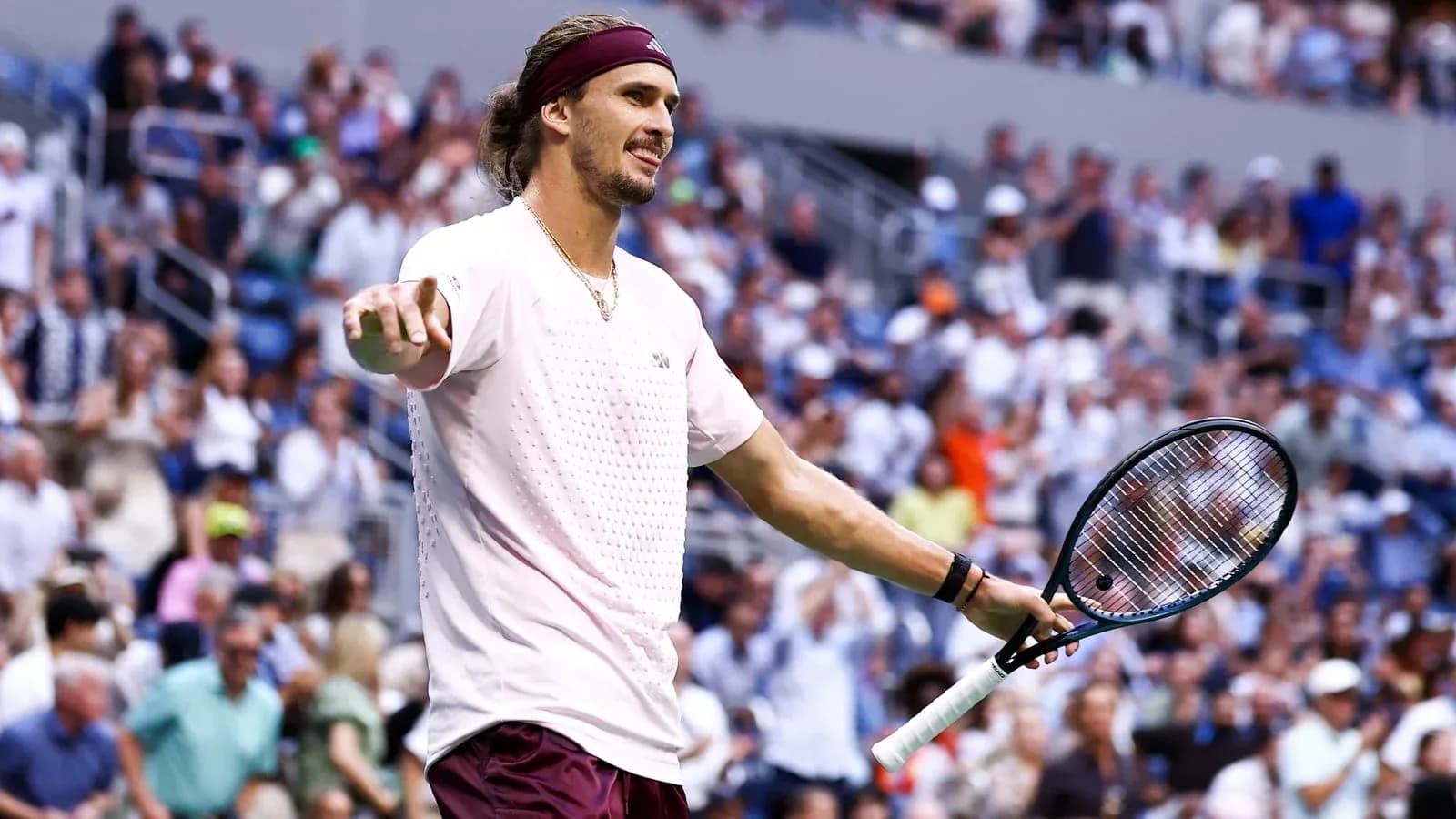Tennis player gesturing to crowd during match Tennis player gesturing to crowd during match