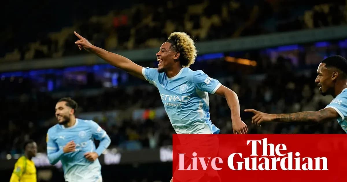 Player celebrating a goal with teammates on field Player celebrating a goal with teammates on field