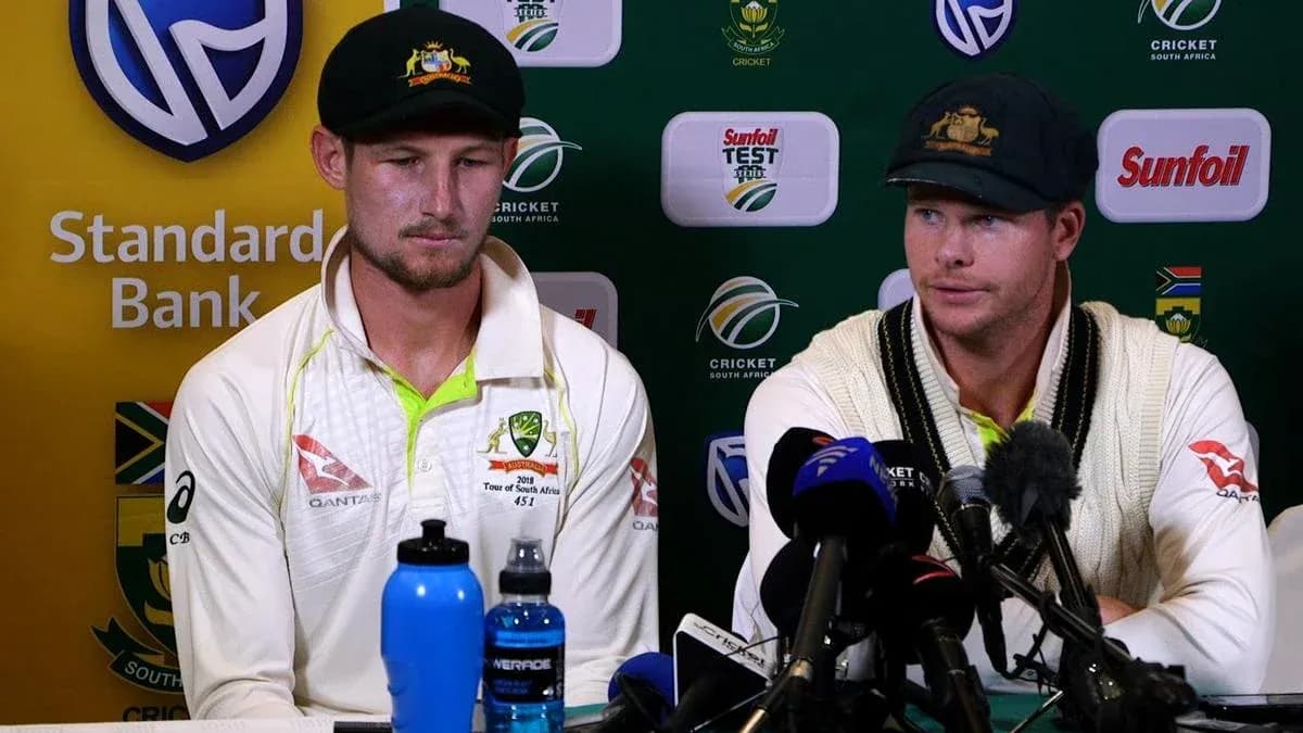 Two cricketers at press conference with microphones Two cricketers at press conference with microphones