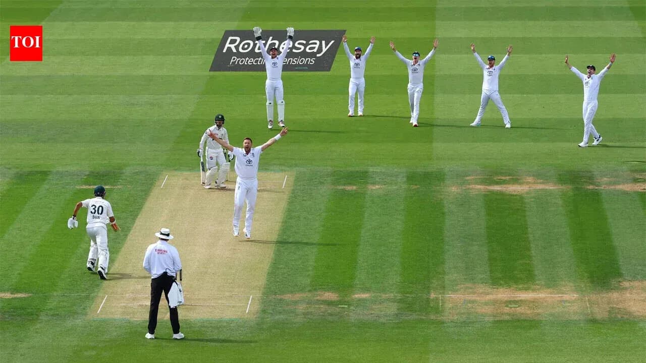Bowlers celebrating a wicket during cricket match Bowlers celebrating a wicket during cricket match
