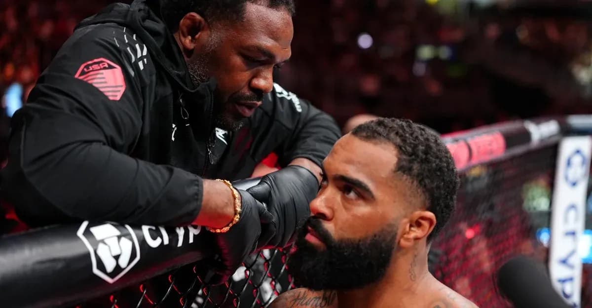 Coach advising fighter in the octagon during match Coach advising fighter in the octagon during match