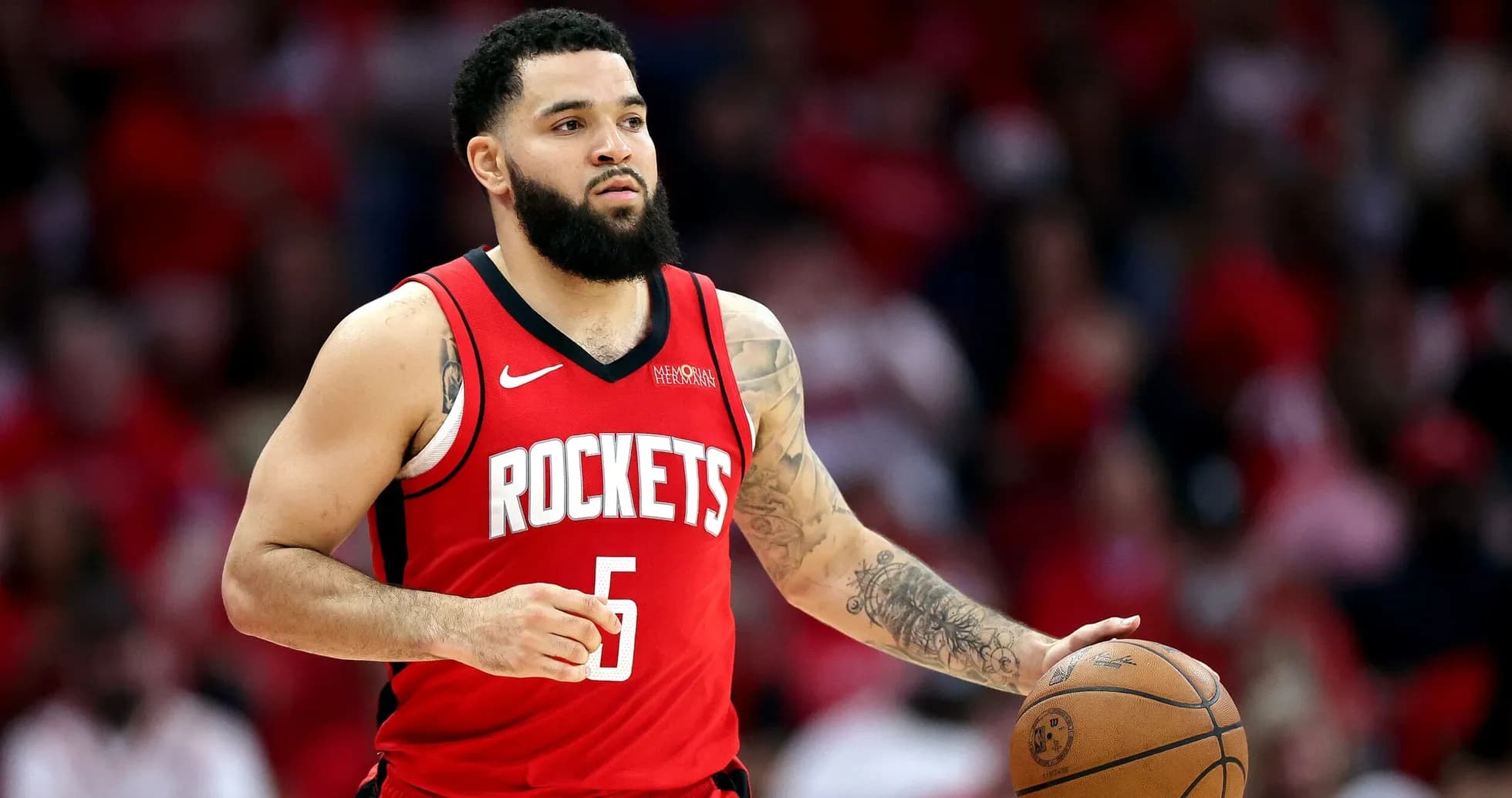 Player dribbling basketball wearing Rockets jersey Player dribbling basketball wearing Rockets jersey