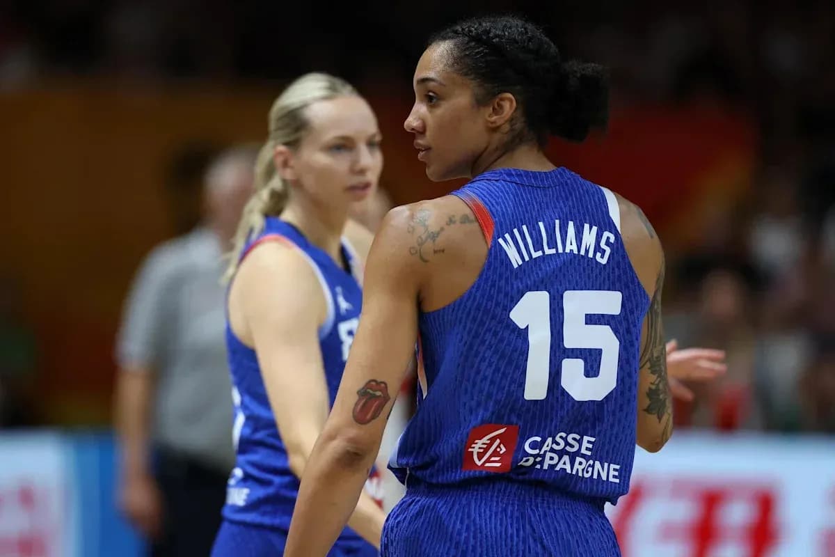 Two basketball players discussing during a game Two basketball players discussing during a game