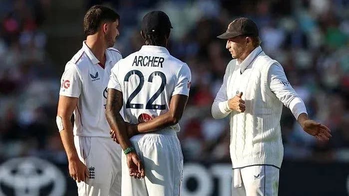 Players discussing strategy during a cricket match Players discussing strategy during a cricket match