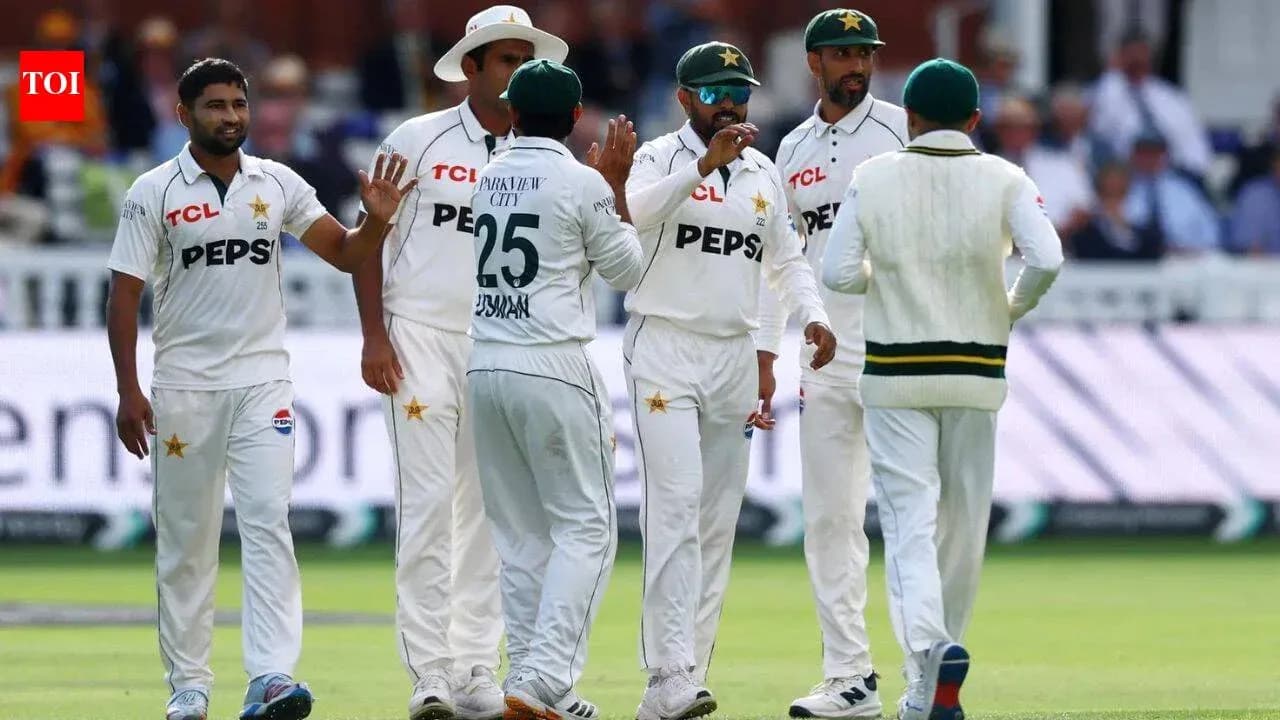Pakistani cricket team celebrating a wicket on field Pakistani cricket team celebrating a wicket on field