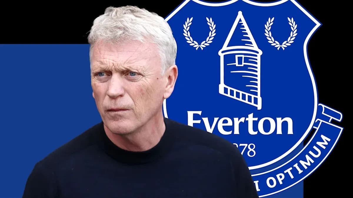 Manager in front of Everton FC logo backdrop Manager in front of Everton FC logo backdrop