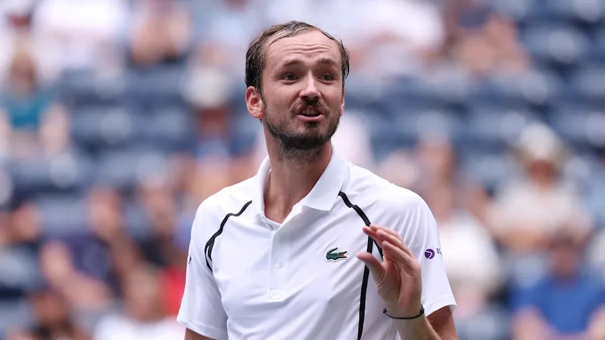 Tennis player gesturing during a match Tennis player gesturing during a match