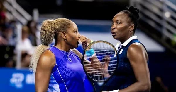 Two female tennis players discussing during match Two female tennis players discussing during match