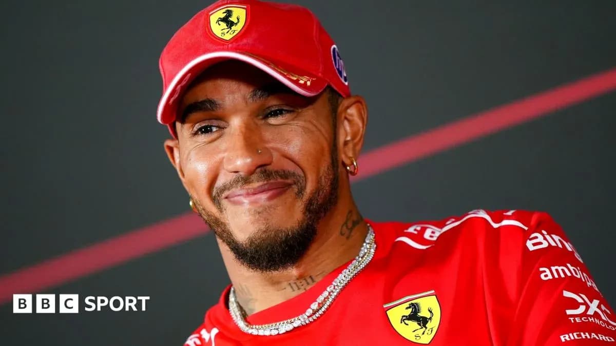 Driver in Ferrari attire during press conference Driver in Ferrari attire during press conference