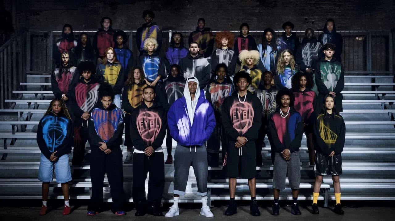 Group of people in hoodies posing on bleachers Group of people in hoodies posing on bleachers