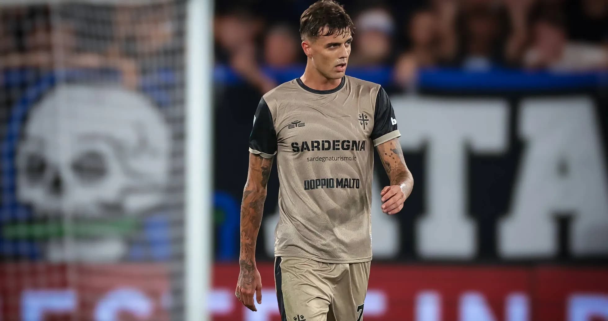 Player walking on field during match wearing team kit Player walking on field during match wearing team kit