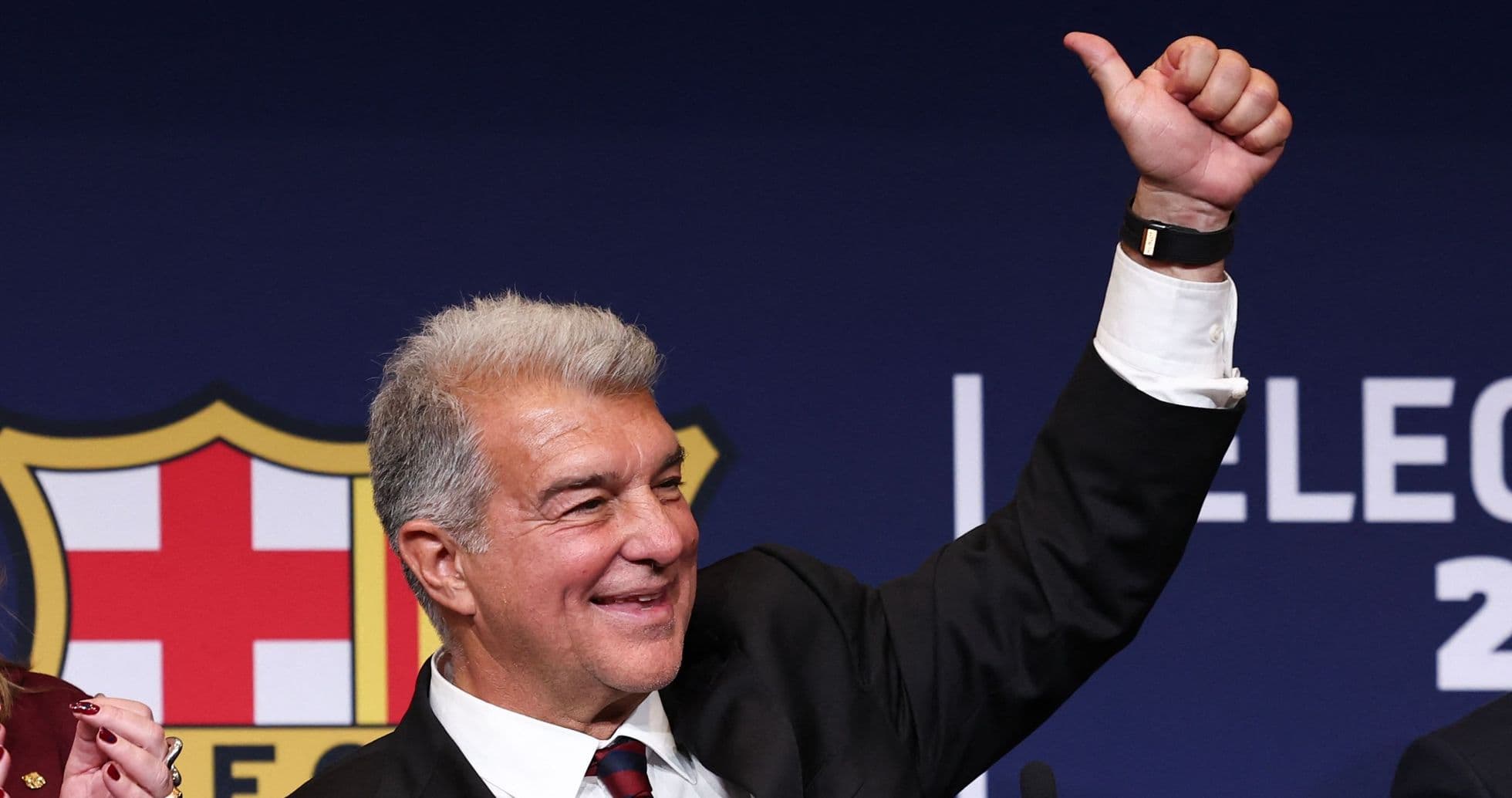 Man giving thumbs up at press conference Man giving thumbs up at press conference