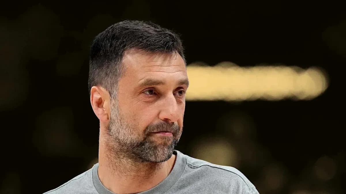 Man with short hair and beard, wearing a gray shirt Man with short hair and beard, wearing a gray shirt