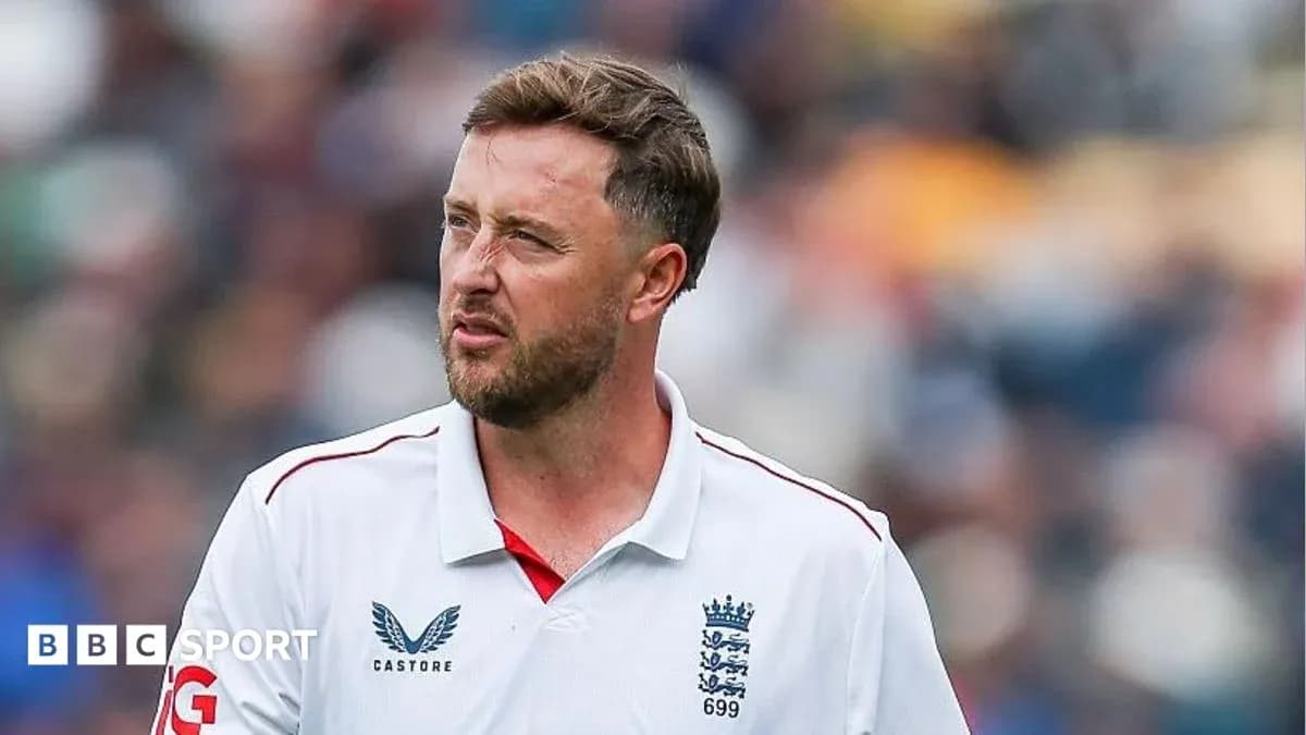 Cricketer wearing England kit on the field Cricketer wearing England kit on the field